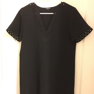 Black tunic dress with cutout trim